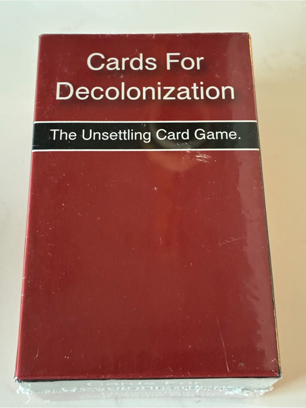 Cards For Decolonization a satire-based card game created by Native Teaching Aid